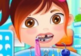لعبة علاج الطفلة في عيادة طبيب الأسنان